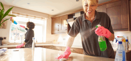Residential cleaners delivering detailed kitchen cleaning.